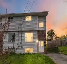 Two-story exterior with light-colored siding and brick accents